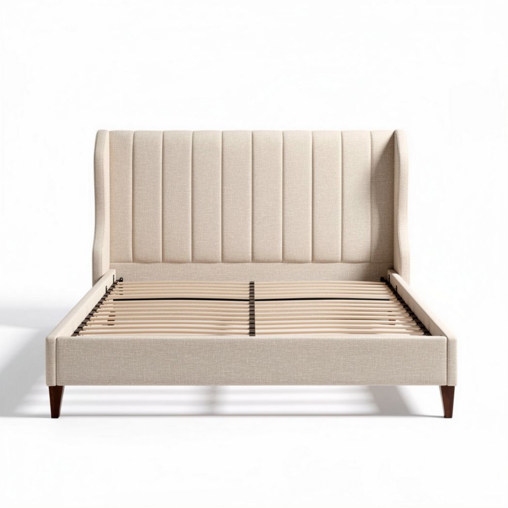 Upholstered bed frame with wood slats and neutral beige fabric finish